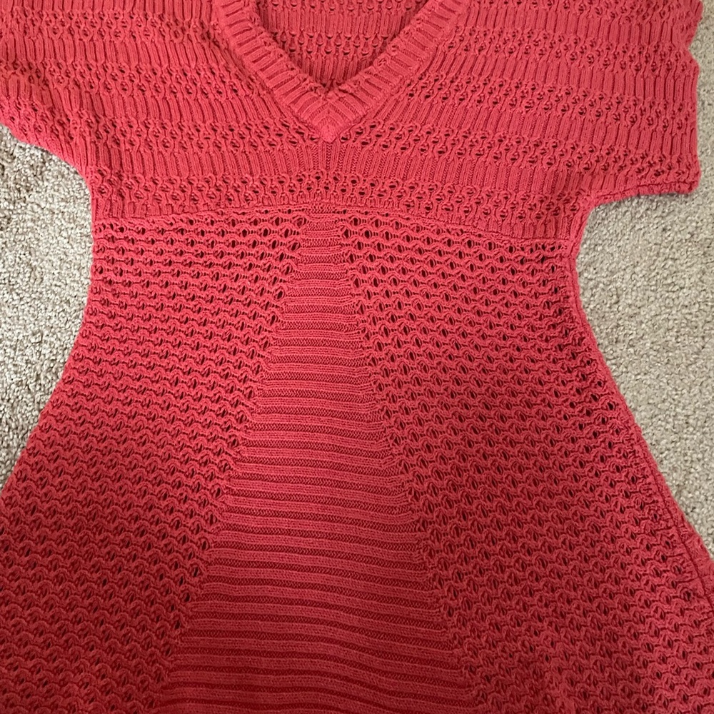 Orange CK short-sleeve sweater. Need to wear something underneath.